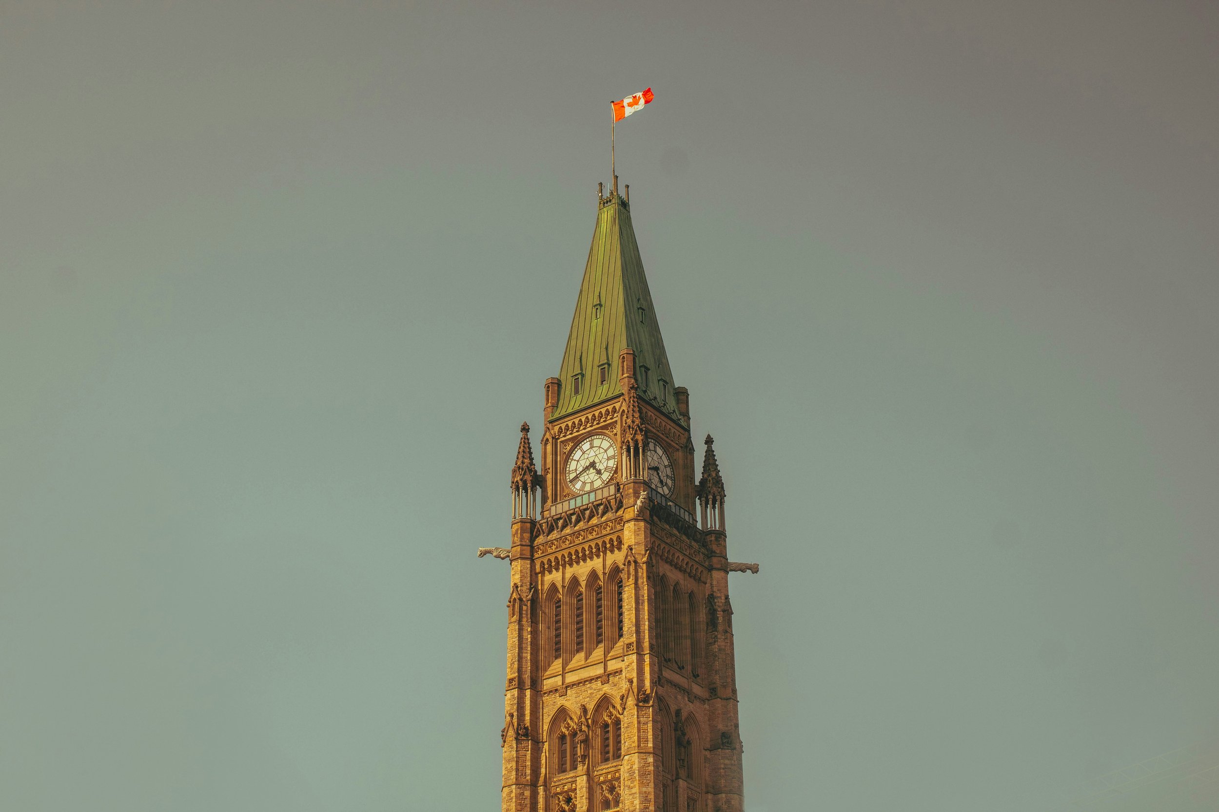 Clock tower with Canadian flag on top