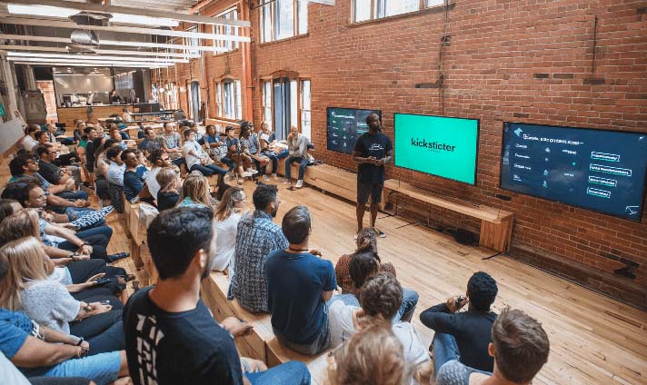 Audience engaged in a presentation at a workshop.